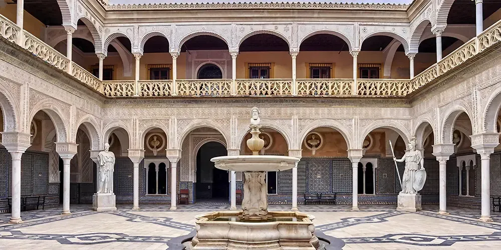 Moorish palace courtyard with arcades and fountain