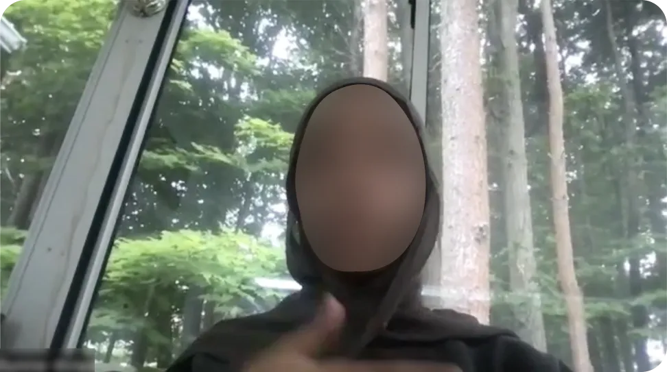 Video interview with a participant, face blurred